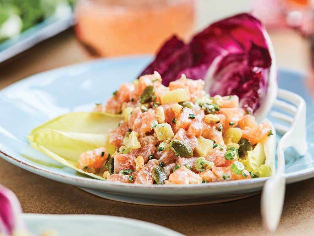 Salmon tartar, roasted and puffed rice in a plate