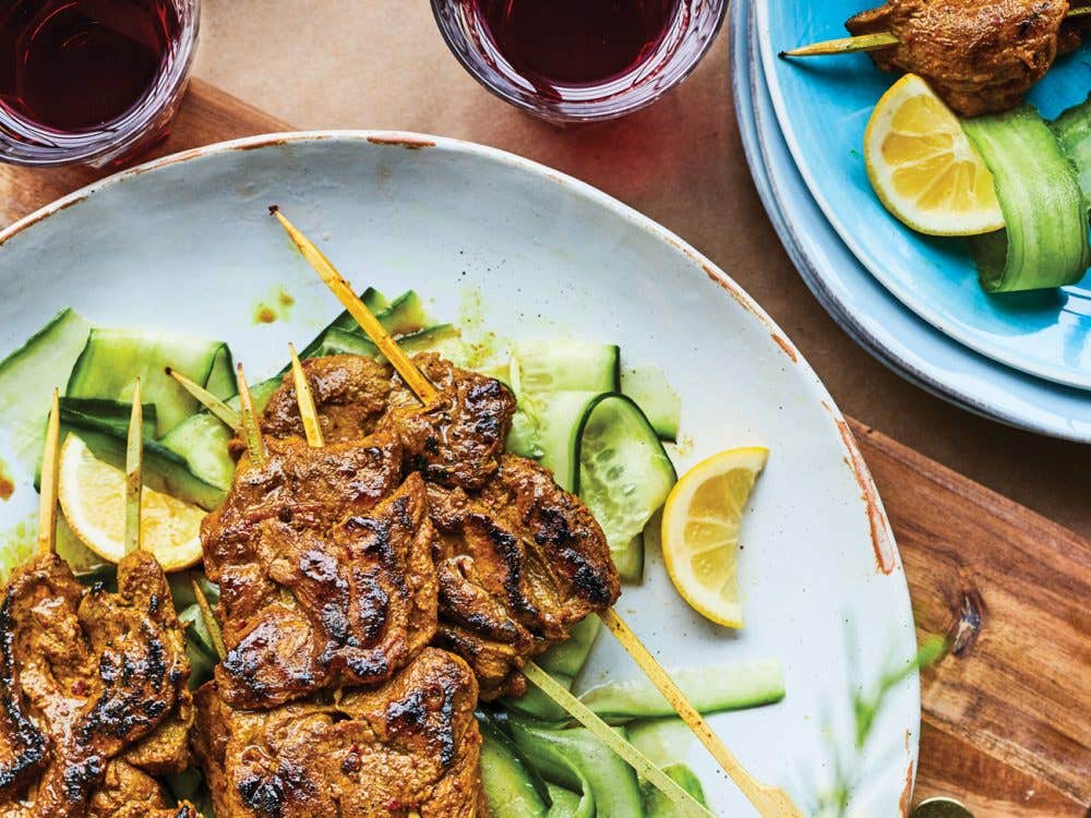 Turmeric lamb satays with cucumber slices