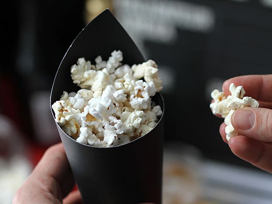 Popcorn served in cardboard cone Popcorn served in cardboard cone