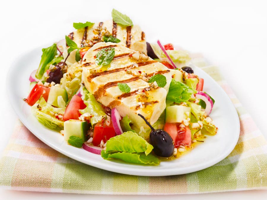 Grilled halloumi cheese on mixed salad