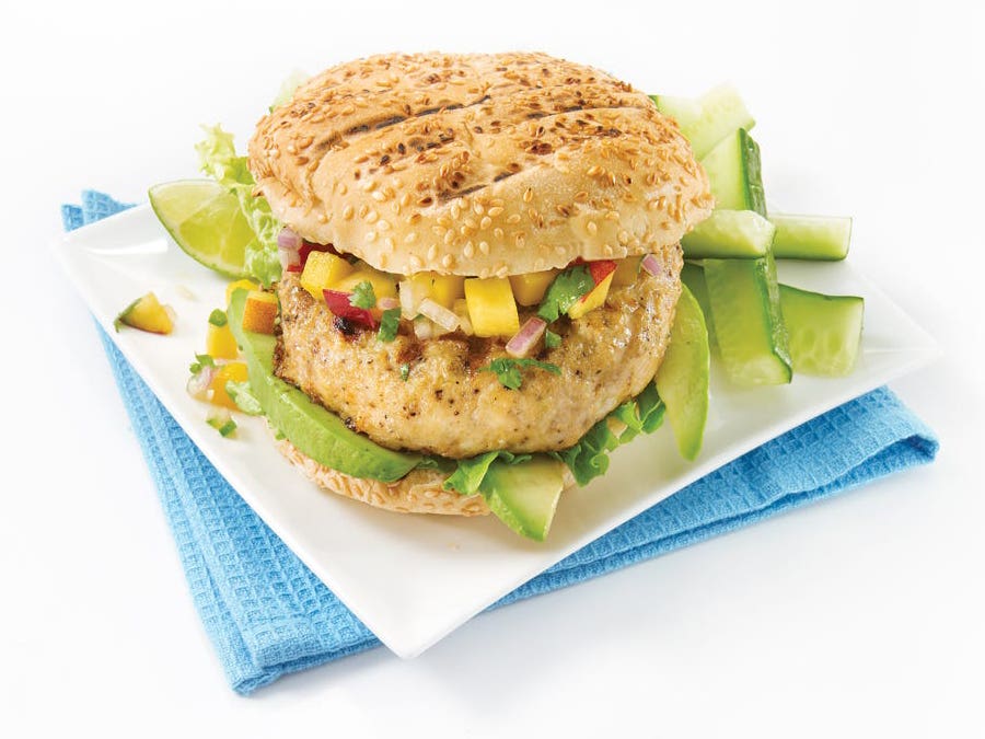 Tropical chicken burgers with avocado, peach and mango salsa